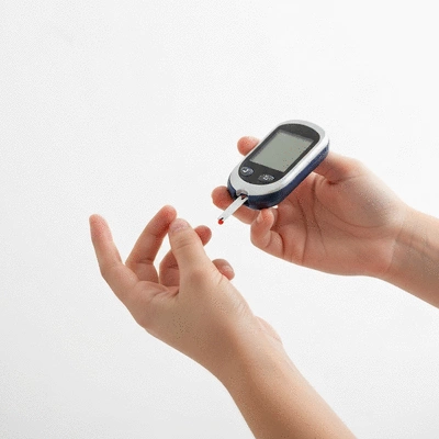 Person checking blood sugar with a monitor